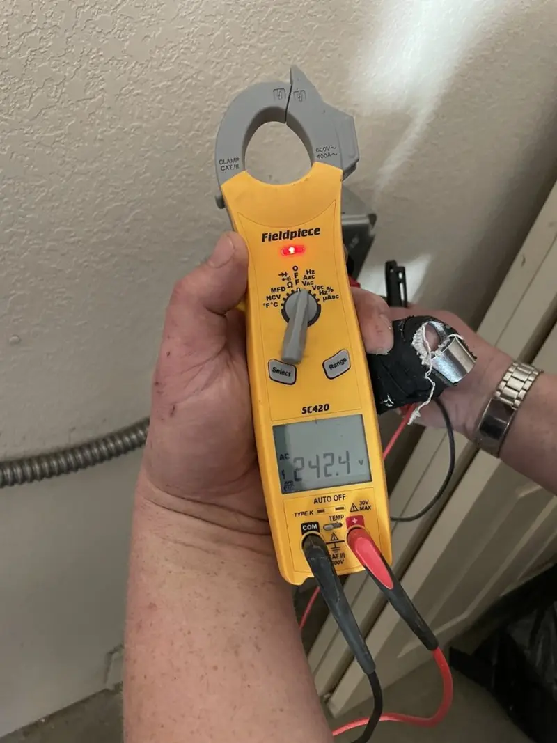 Voltage testing with clamp meter during Outlet Installation in Kanab